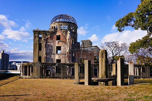 The Atomic Bomb Dome, a World Heritage Site, along the Motoyasu River in Hiroshima City, Hiroshima Prefecture, on a sunny day in March 2023