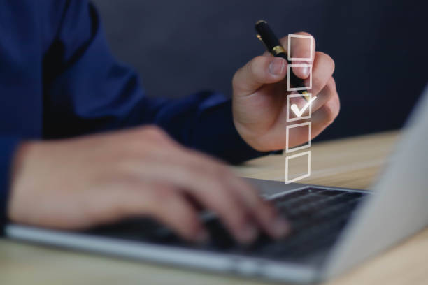 istock Businessman checks a check mark on the checklist with a check mark 1478031720