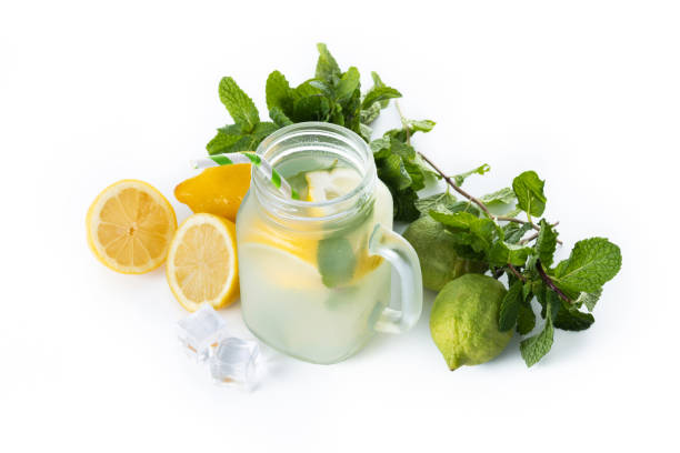 istock Lemonade drink in a jar glass isolated on white background 1478032884
