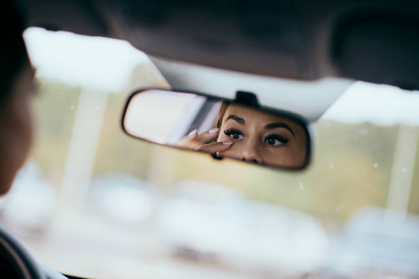 istock woman in car with makeup 1478033333