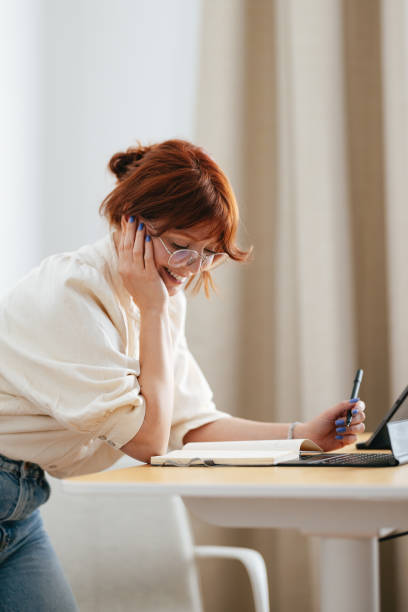 istock Happy Female Student Using A Digital Tablet At Home 1478036456