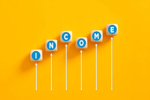 istock The word income on wooden cubes with an increasing graph. 1478036666