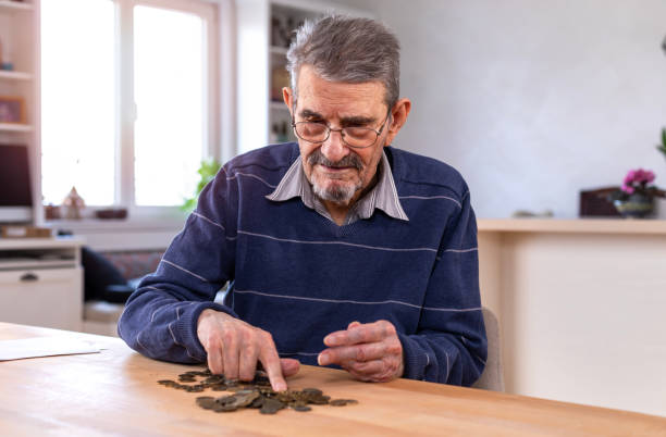 istock Senior man counting money 1478037148