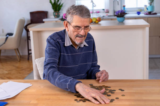 istock Senior man counting money 1478037183