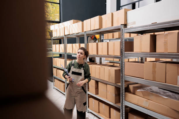 istock Stockroom supervisor looking at cardboard packages 1478038595
