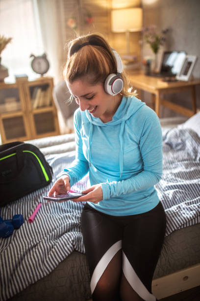 istock Woman preparing for workout and using  the phone 1478040278