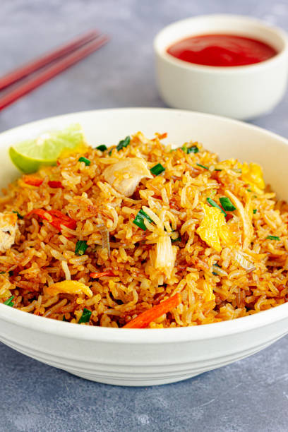 istock Fried Rice Close-Up Vertical Photo with Sauce and Chopsticks 1478042277