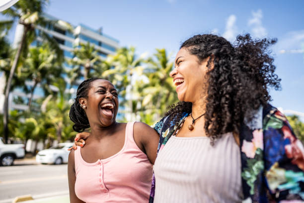 Two female friends walking in the broadwalk