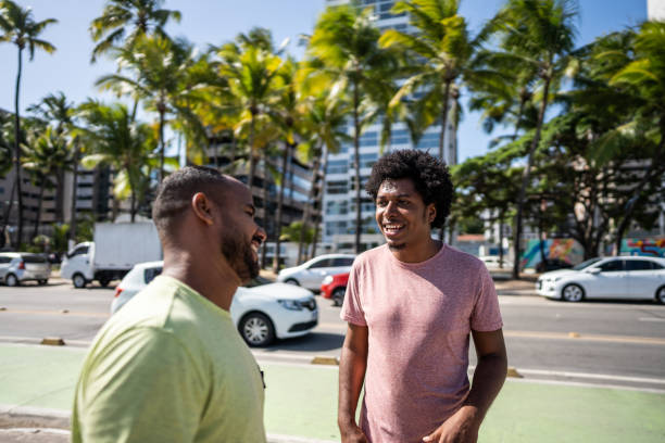 istock Two mid adult male friends talking in a boardwalk 1478043705