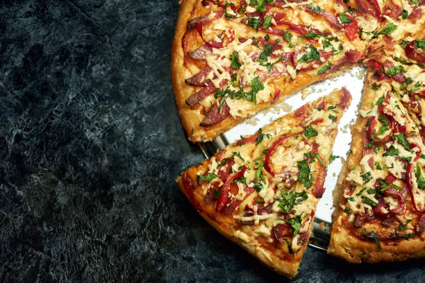 istock Sliced pizza with cheese and vegetables 1478046843