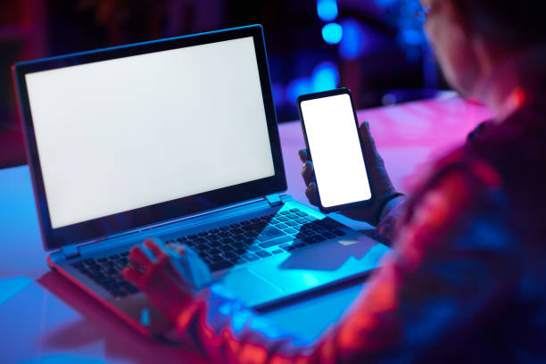 istock Seen from behind modern female with laptop blank screen 1478050837