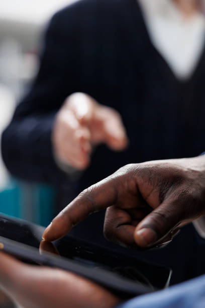 istock Showroom employee checking clothes inventory on tablet 1478057790