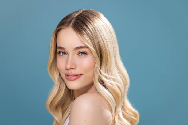 Natural beauty Studio shot of a beautiful natural blonde woman with perfect skin, enjoying in her perfect skin. blond hair stock pictures, royalty-free photos & images