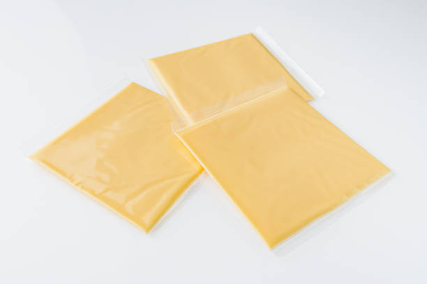 istock slices of American cheddar cheese on a white background 1478059234