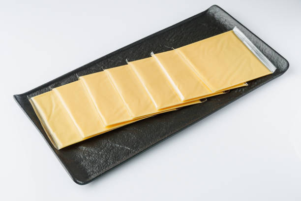 istock slices of American cheddar cheese on a white background 1478059242