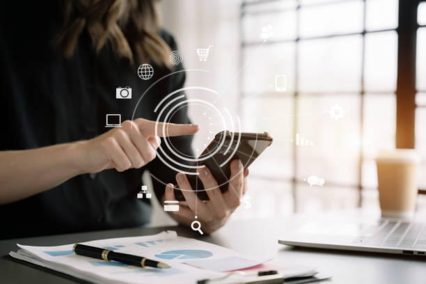 istock Hand using smart phone, mobile p payments online shopping, omni channel, digital tablet docking keyboard computer. 1478059555