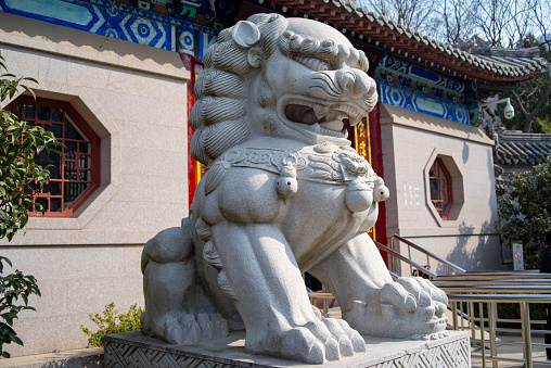 A traditional chinese guardian lion (also known as a Fu Dog) in the Forbidden City, Beijing, China.  This is from the Ming Dynasty.