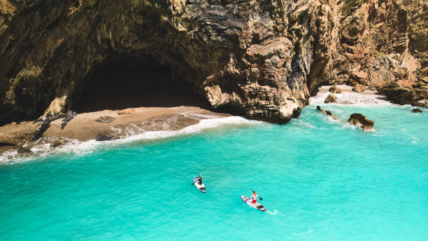 istock Man and woman on sup boards 1478063247