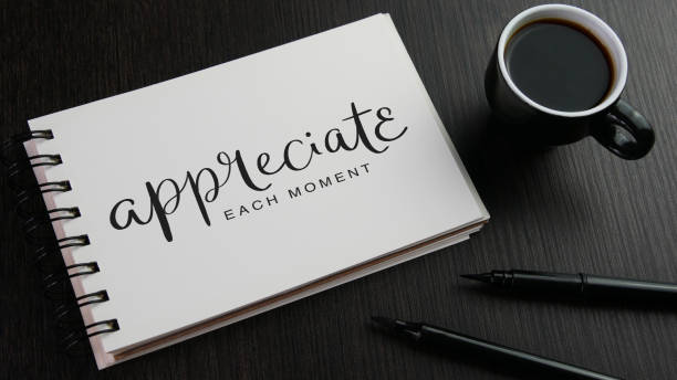 istock APPRECIATE EACH MOMENT black hand lettering in notebook 1478072949