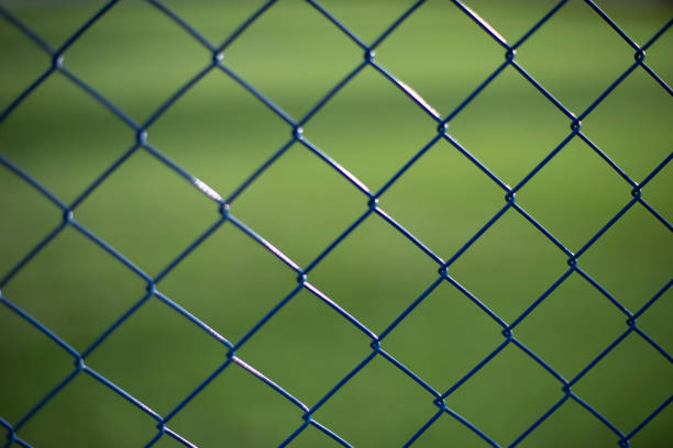 istock Mesh fence on vernacular background. Fence details. 1478074873
