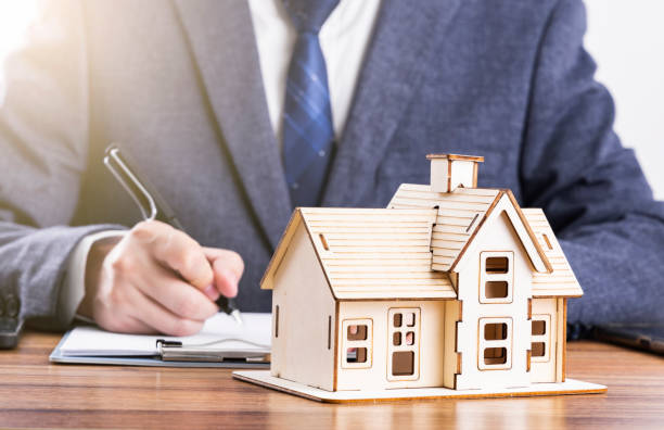 istock Business people and model houses 1478075604