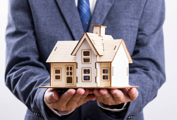 istock Business people and model houses 1478075608
