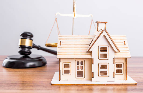 istock Judge hammer and house model 1478075659