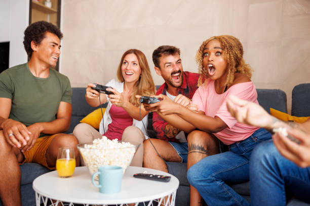 istock Group of friends having fun playing video games 1478076927