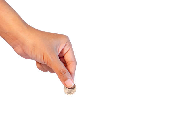 istock woman holding a silver coin 1478077270