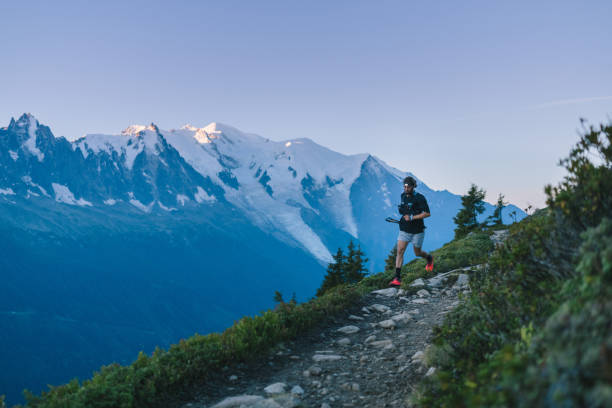 istock Trail runner bounds along mountain trail 1478078965