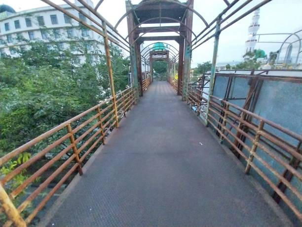 istock Pedestrian Bridge Above Two-Lane Road in Poor Condition 1478080267