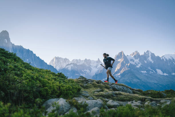 istock Trail runner bounds along mountain trail 1478080335