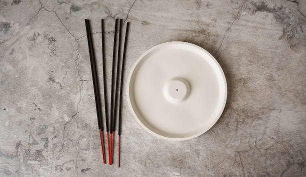 istock Incense stick in porcelain craft ceramic holder on marble table 1478081830