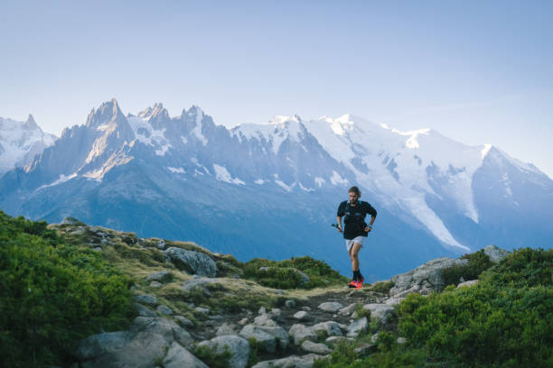 istock Trail runner bounds along mountain trail 1478081993