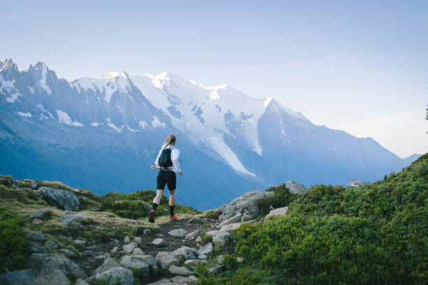 istock Trail runner bounds along mountain trail 1478081996