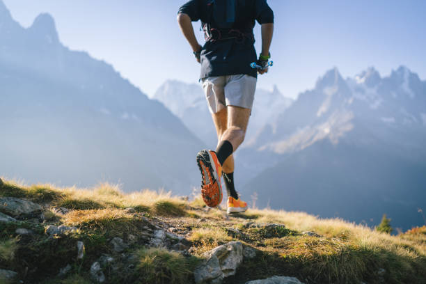 istock Trail runner bounds along mountain trail 1478082426