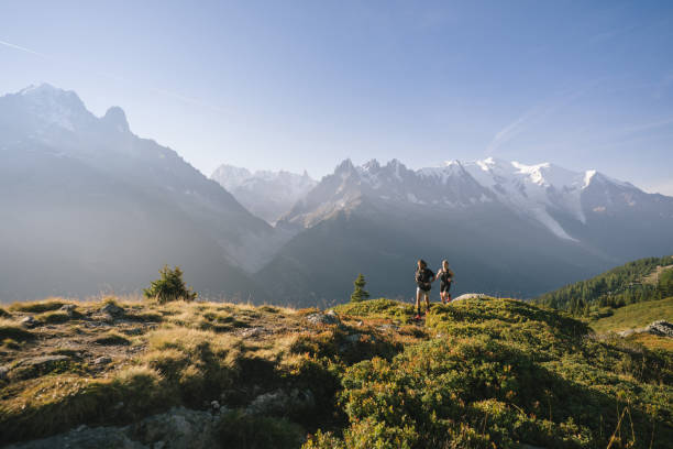 istock Trail runners bound along mountain trail 1478082519