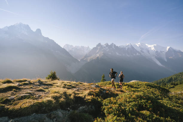 istock Trail runners bound along mountain trail 1478082539