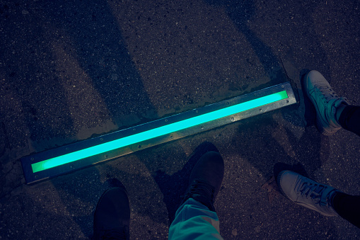 Integrated crosswalk stoplight for pedestrians in asphalt.