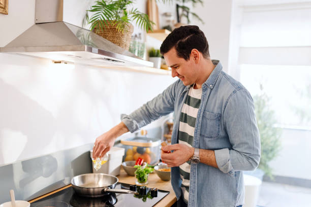 istock Husband preparing a lunch in the kitchen 1478089987