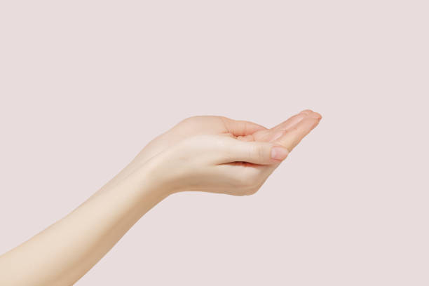 istock Woman stretches her hands to the side. Demonstrating empty space on her hands. 1478090936
