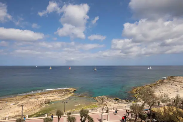 panorama view of promenade and bay in Sliema, Malta. sailingboats on the sea. summer holiday view