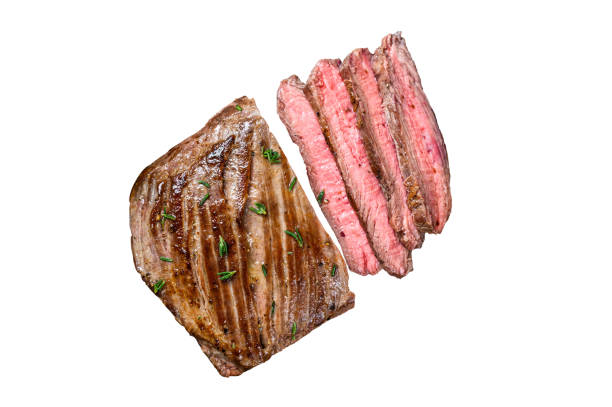istock Sliced flank or bavette beef meat steak on a cleaver. Isolated on white background 1478093157