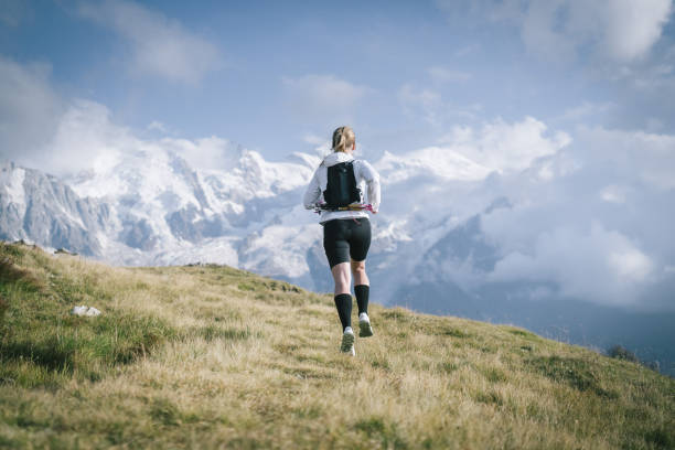 istock Trail runner bounds along mountain trail 1478094753