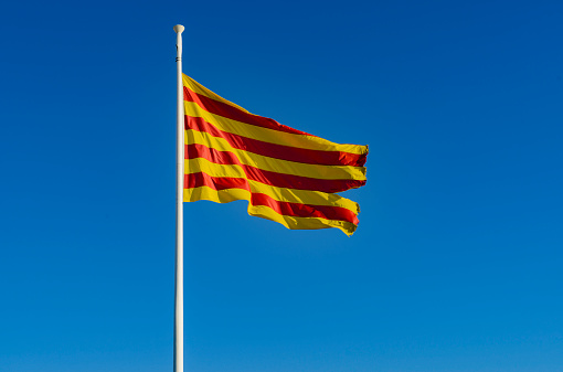 Detail of the flag of Catalonia in Spain