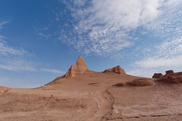 istock Breathtaking desert landscape featuring tall, red-hued rock formations against a bright blue sky 1478099003