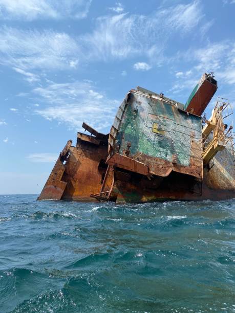 istock Rusty remains of a sunken ship submerged in water 1478100807