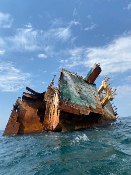 istock Rusty remains of a sunken ship submerged in water 1478100809