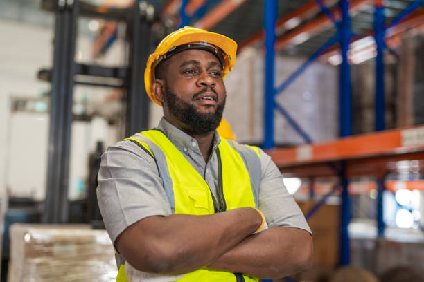 istock African men worker wearing working suite dress and safety helmet at cargo for stack item for shipping.female worker checking the store factory. industry factory warehouse. Inspection quality control. 1478101010