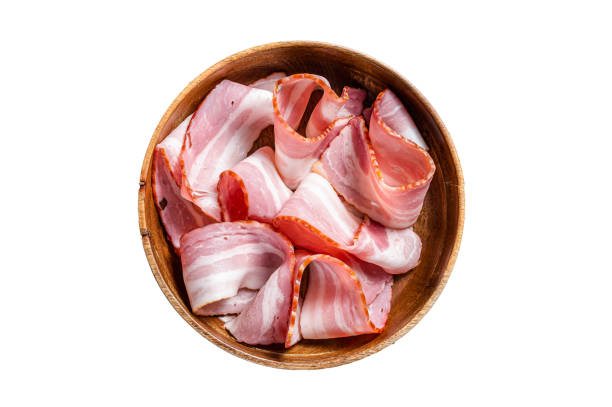istock Smoked sliced bacon in wooden plate.  Isolated on white background. 1478102073